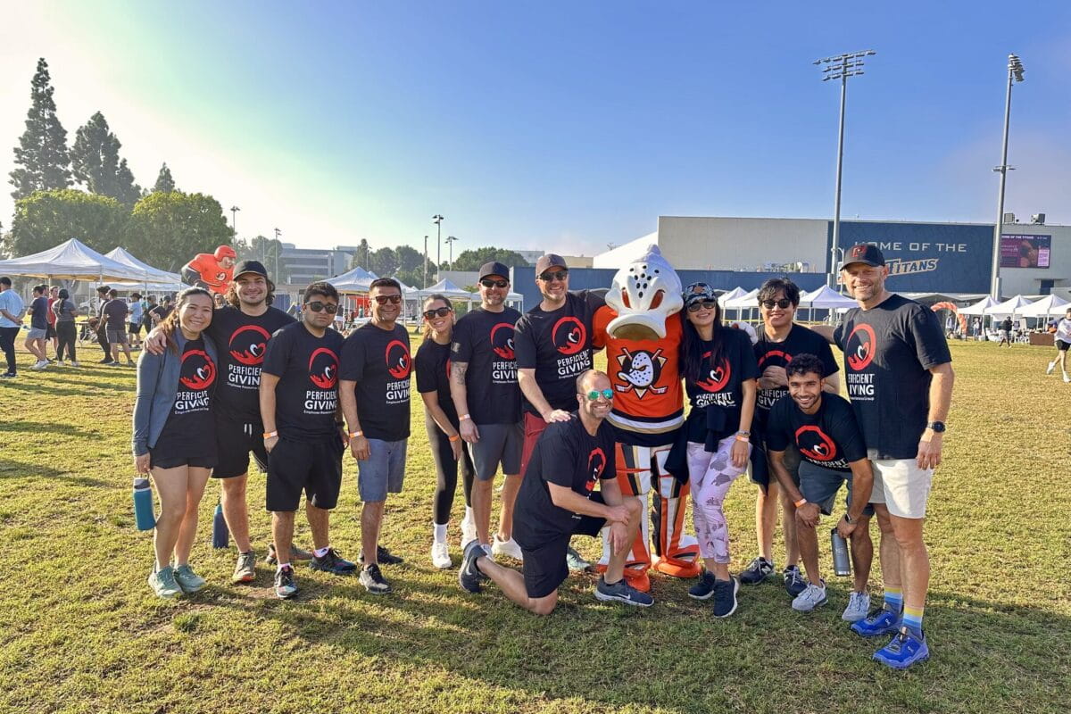 Perficient SoCal colleagues at a Perficient Giving event with the Anaheim Ducks mascot.