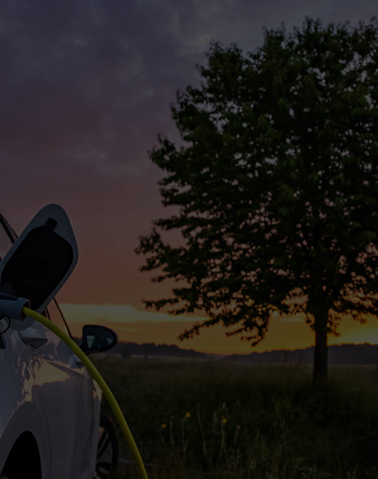 An electric vehicle charging, mobile hero.