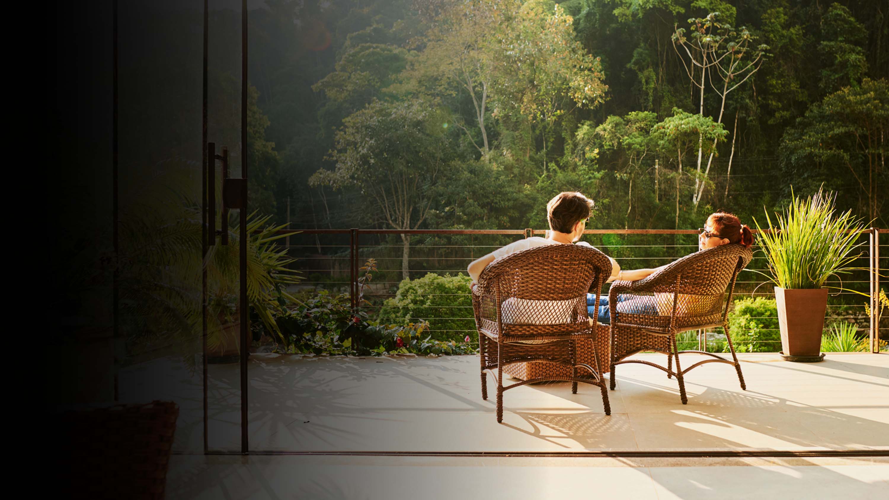 Two people relaxing on a tropical vacation.