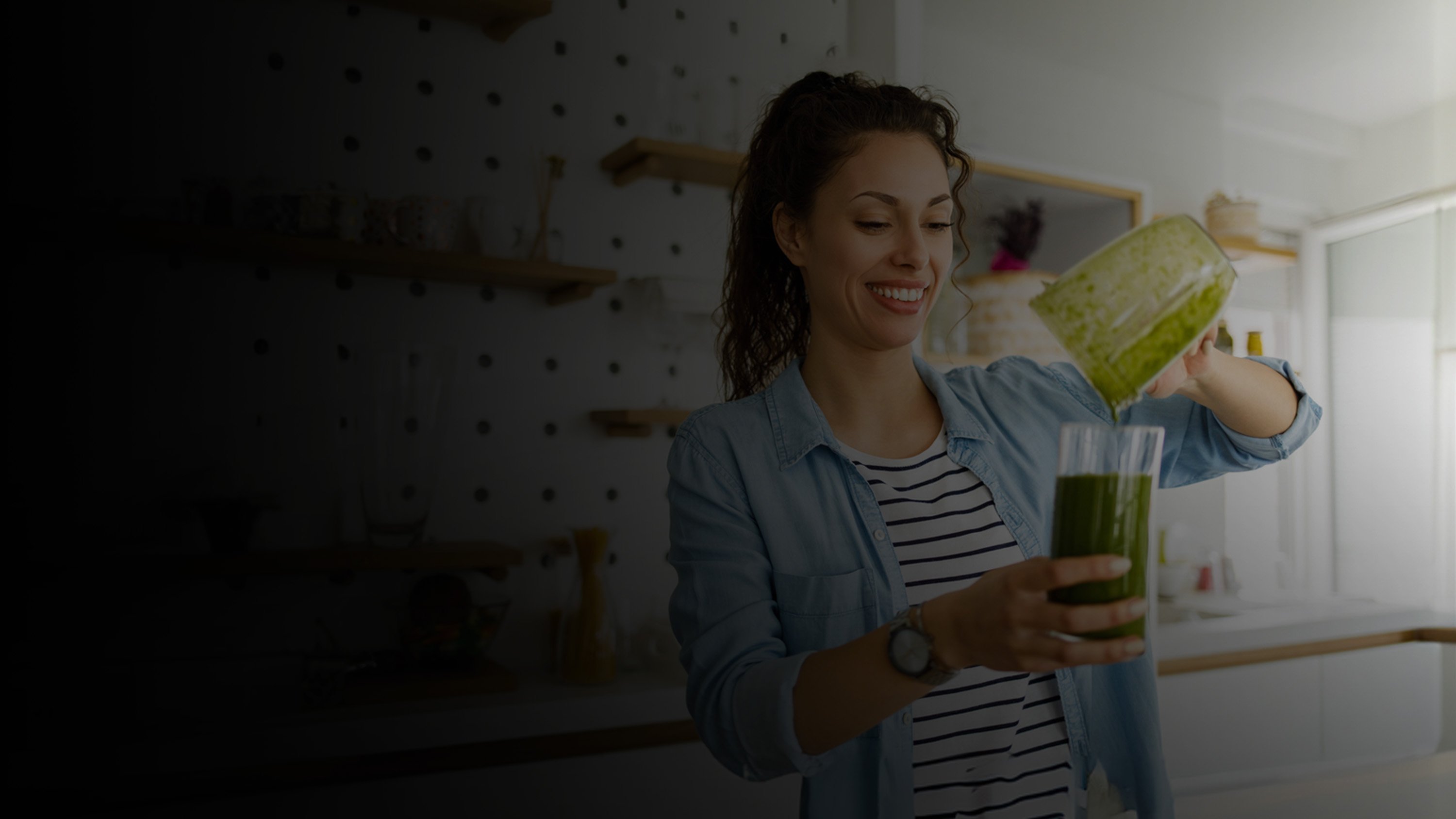 Woman pouring a smoothie