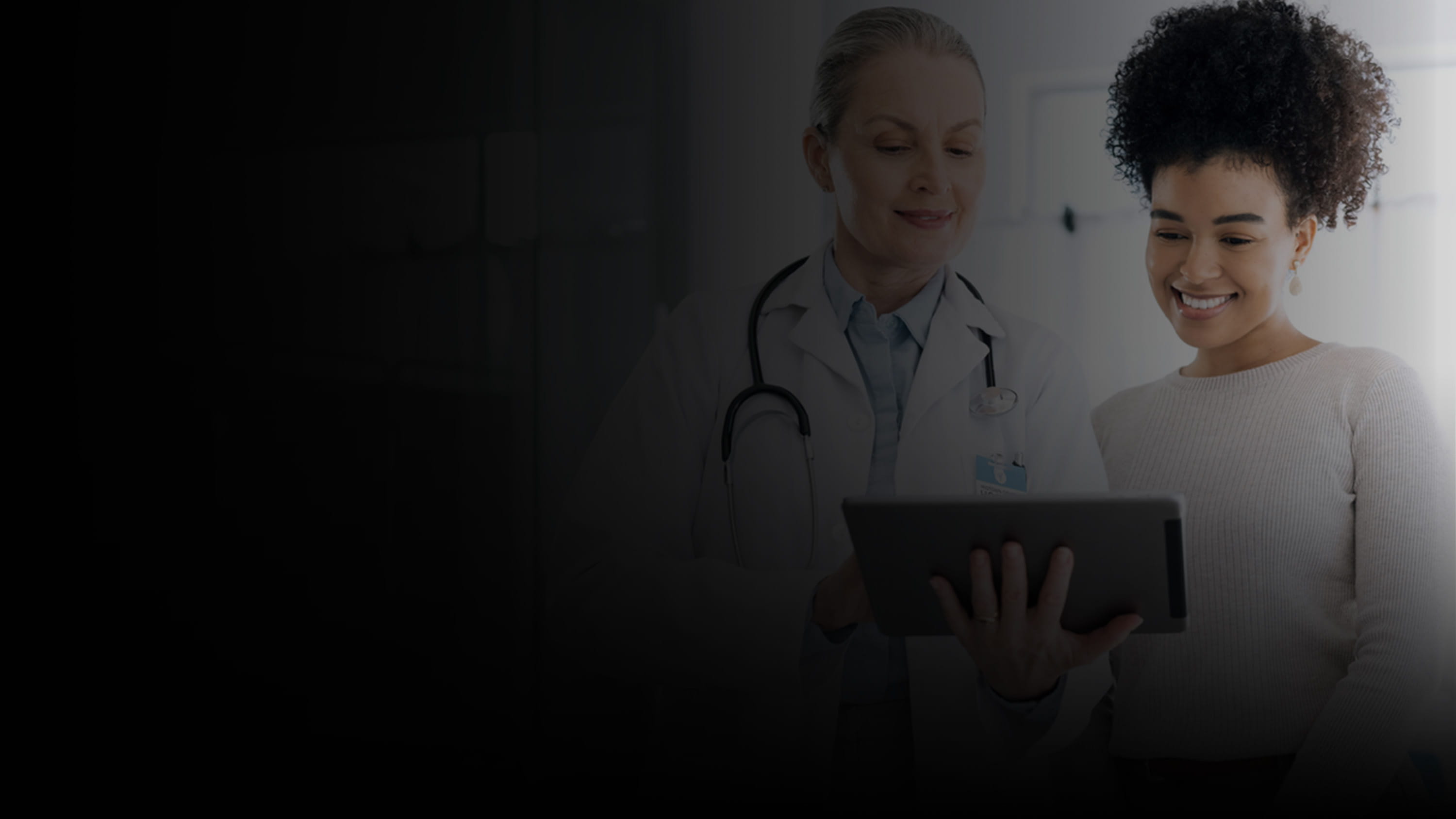 Doctor and Patient looking at tablet