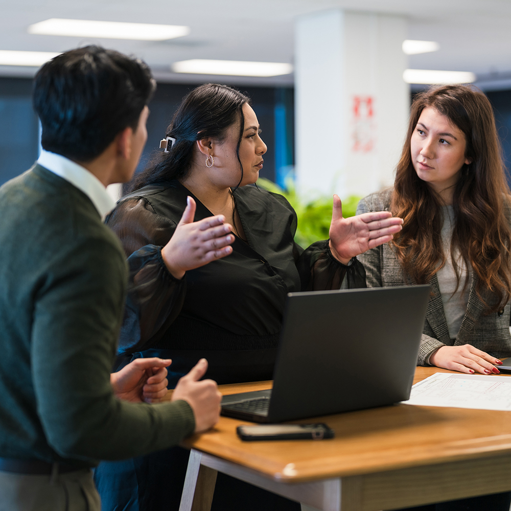 3 people talking to one another