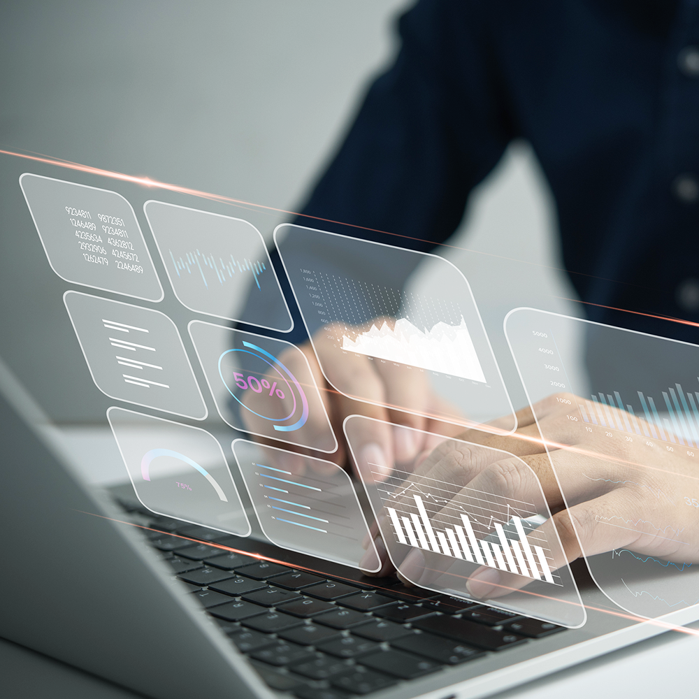 Data, charts, graphs over a laptop.