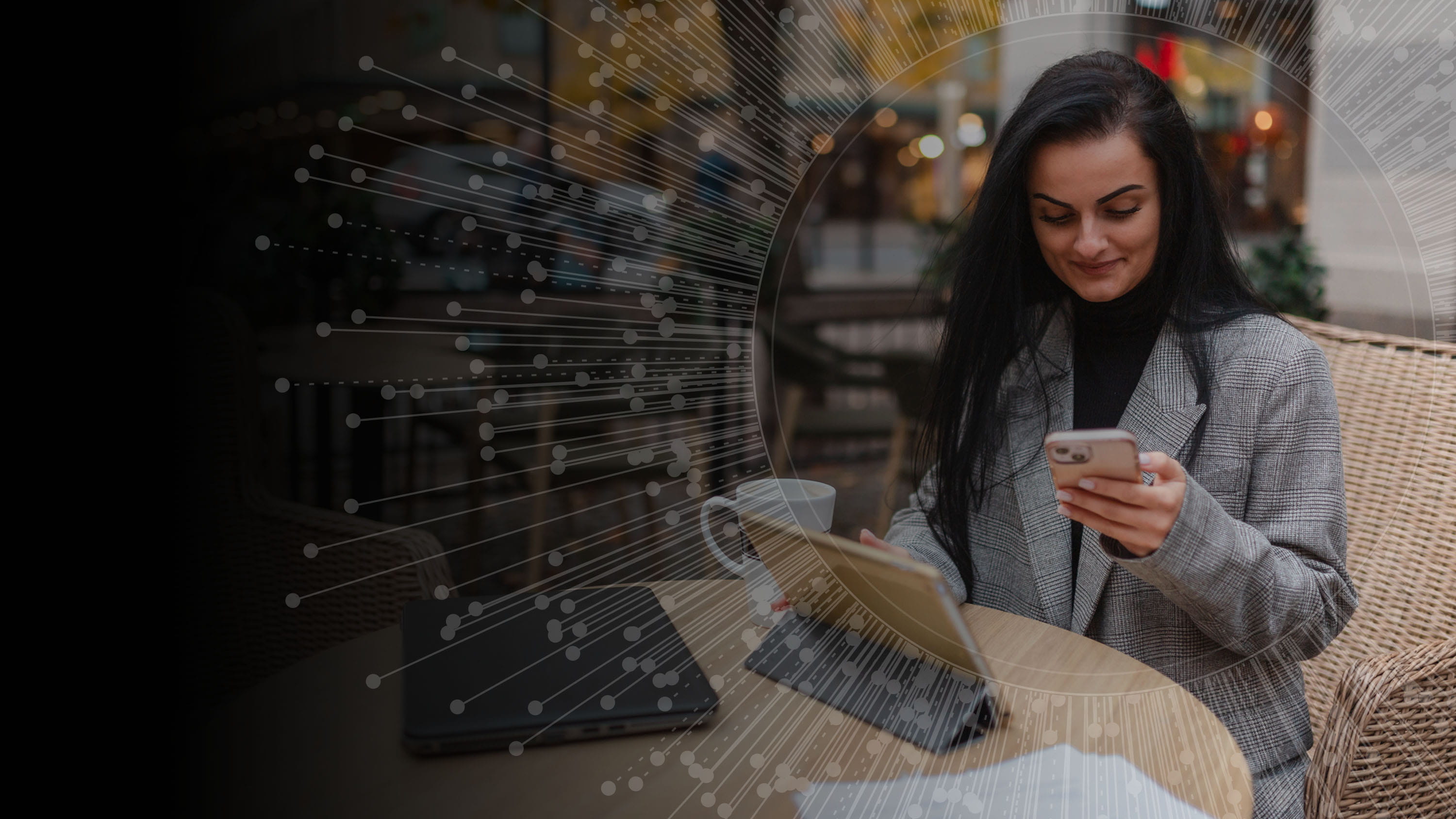 A woman working on a smart phone and tablet, concept of human-centered design.