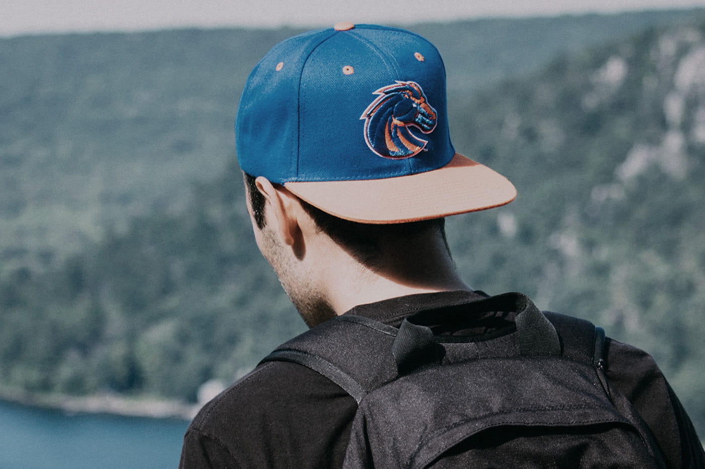 Man wearing a baseball cap.